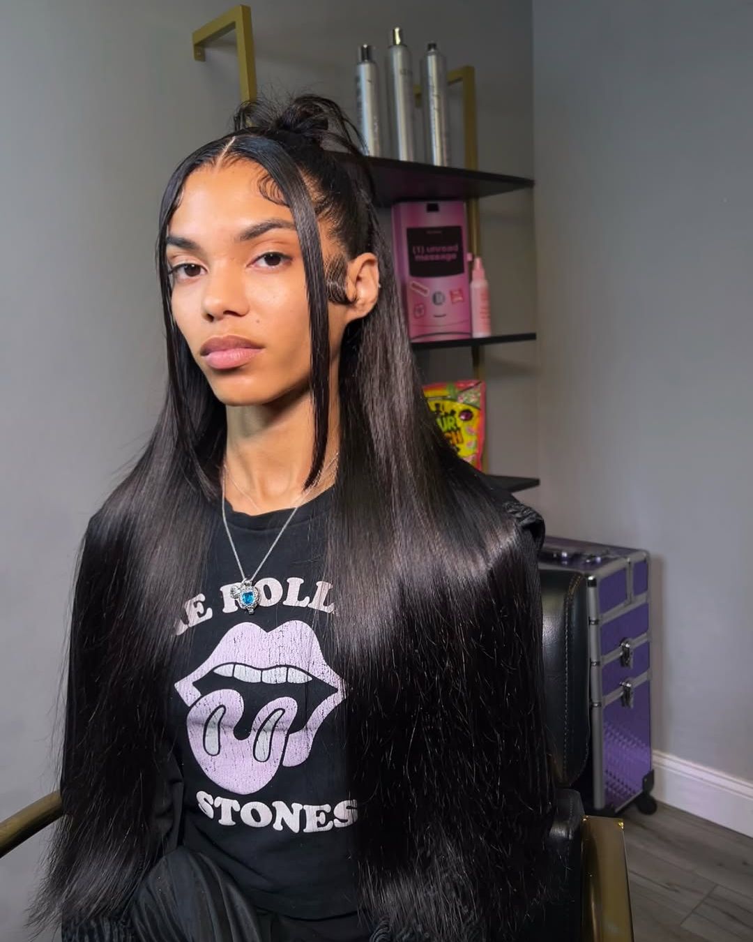 Sleek straight install with top knot and braided part
